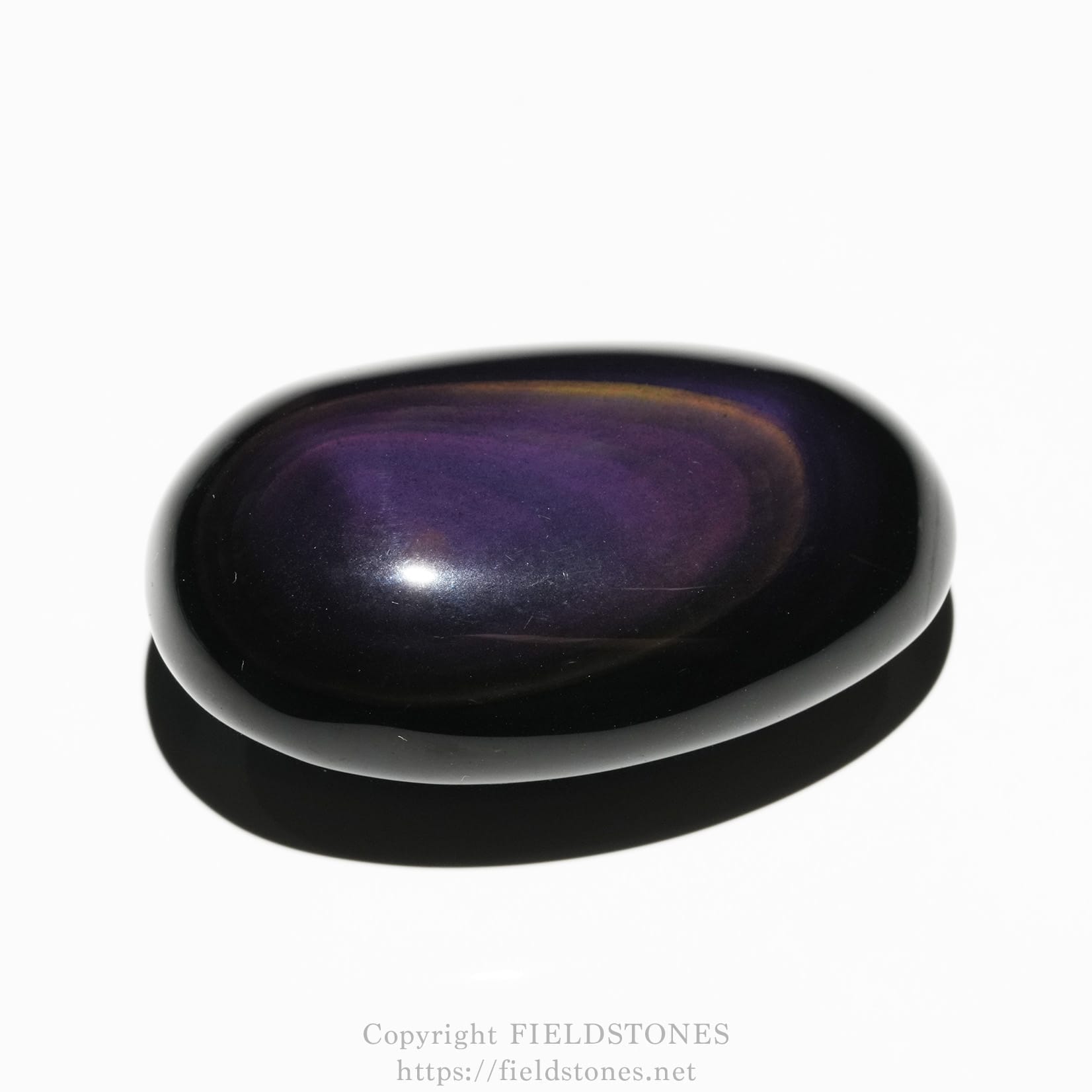 6684-1 - FieldStones Polished purple oval gemstone (cabochon) on a white background, glossy surface.