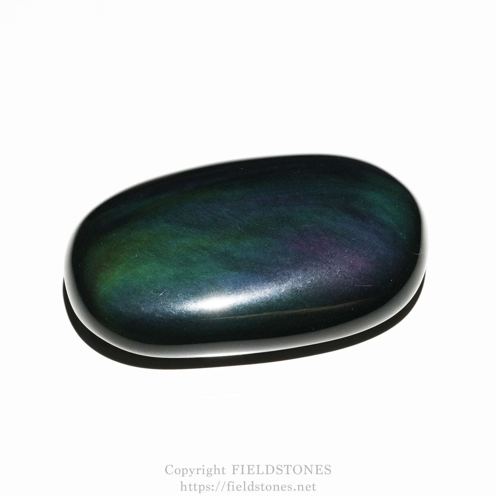6685-3 - FieldStones Polished dark stone with iridescent rainbow sheen on a white background.