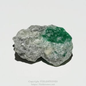 Rough gray rock with bright green crystalline patches on one side, a mineral specimen.