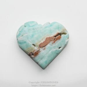 Blue-green heart-shaped stone with brown mineral veining on a white background.