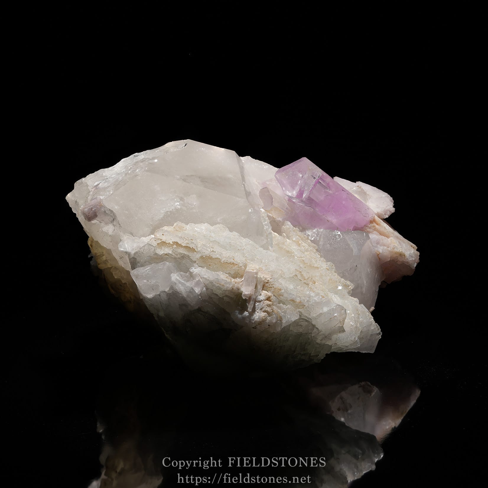 6725-8 - FieldStones Cluster of pale white quartz with pinkish-purple amethyst crystals on a light matrix against a black background.